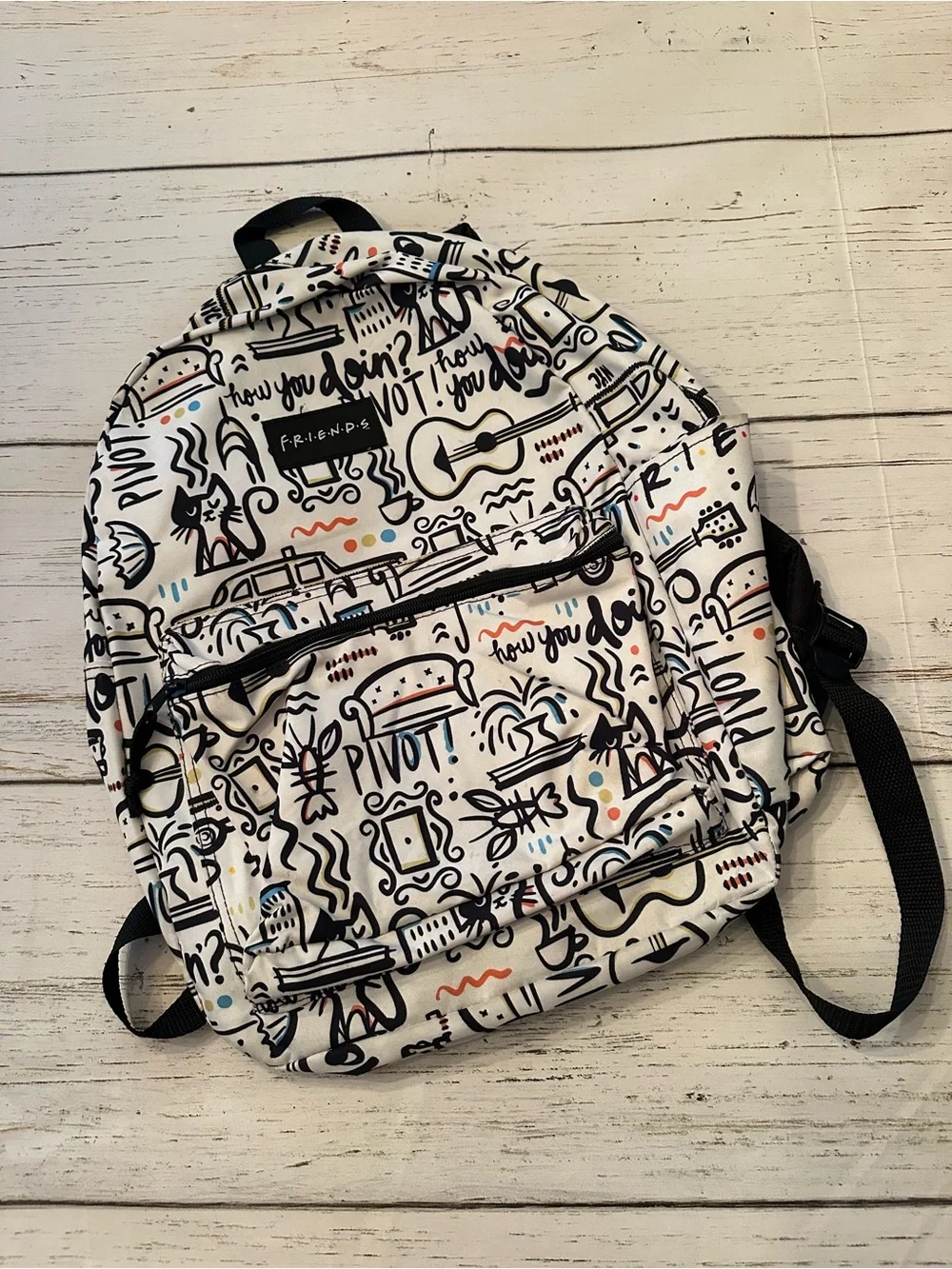 FRIENDS White Backpack with Black Accents and Multicolor Doodles